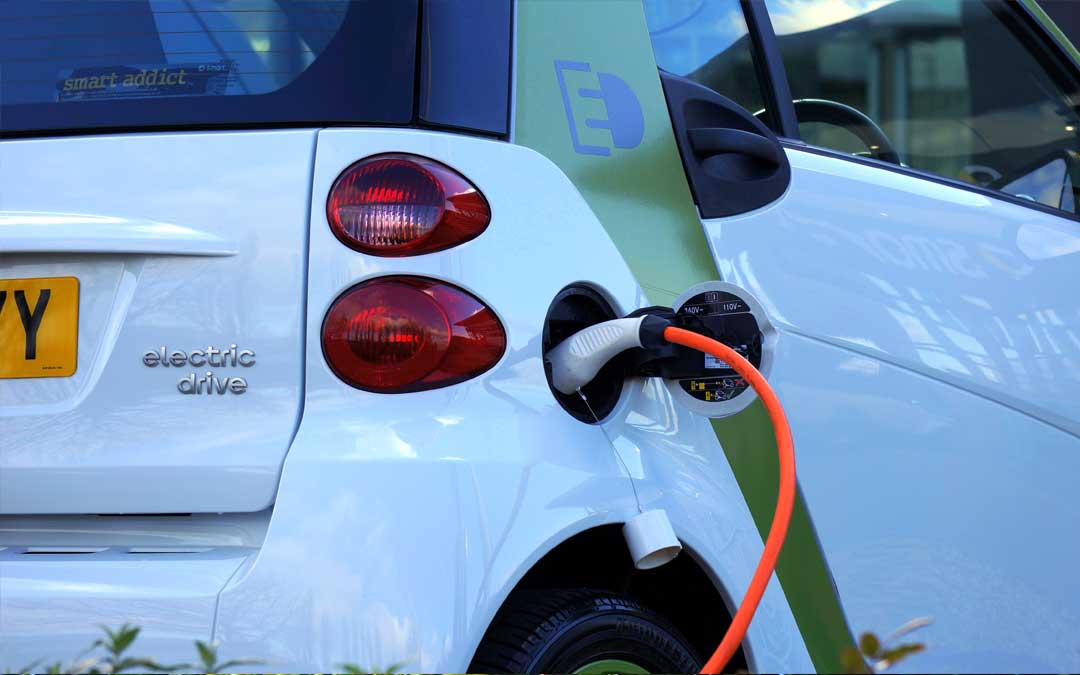 electric car connected to a charging socket