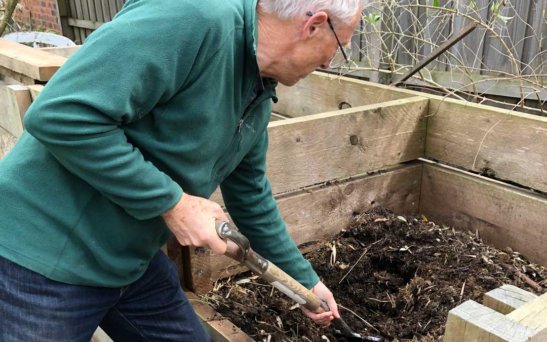 preparing-a-vegie-garden Paul digging compost when preparing a vegie garden