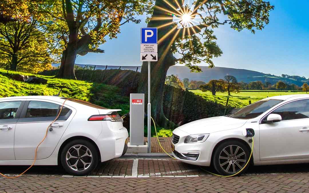 electric-cars-charging 2 electric cars at a charging dock